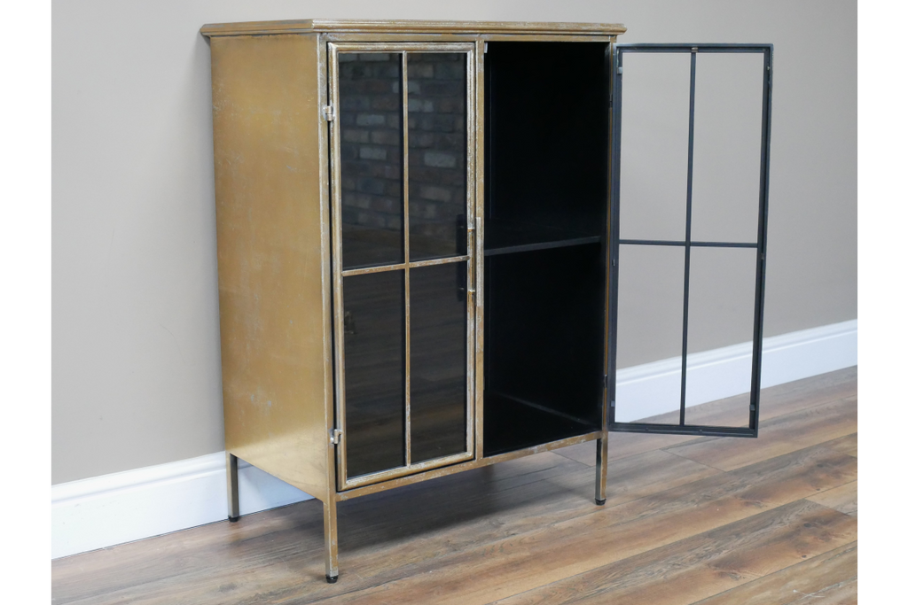 Small muted gold slim glass fronted metal display cabinet.