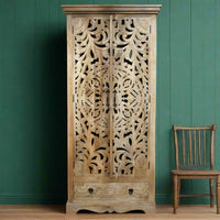 Tall ornate carved natural wood shelved cupboard