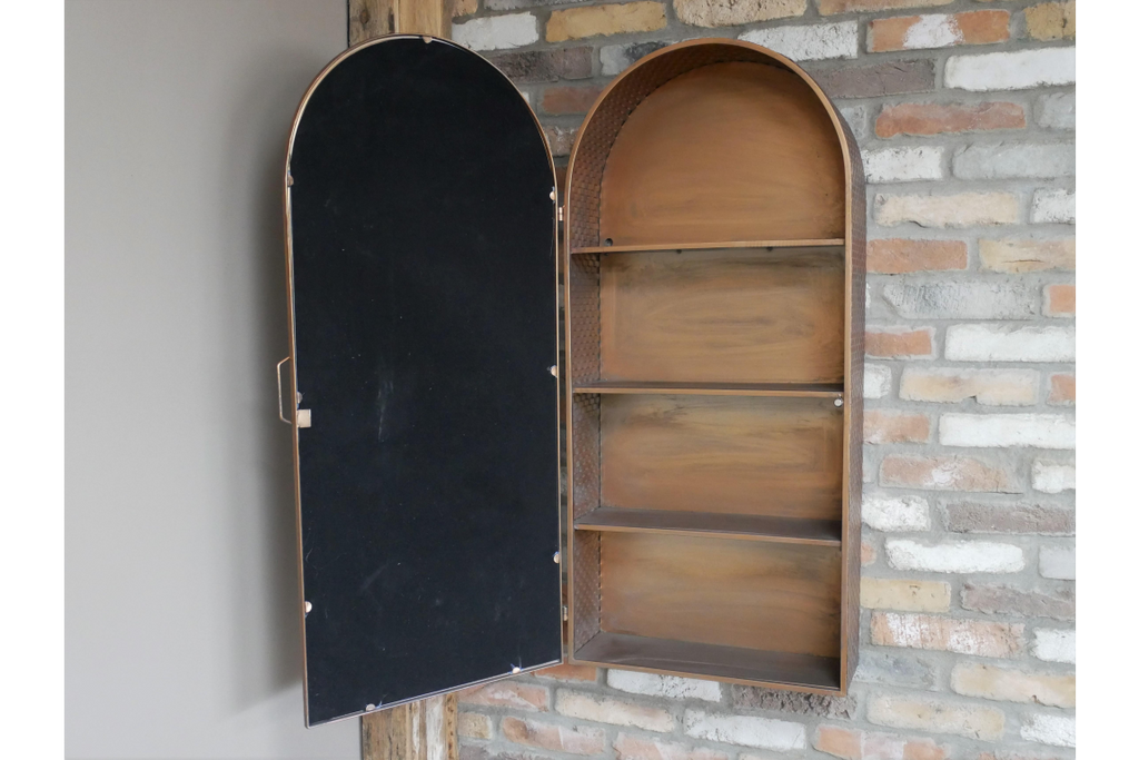 Tall mirrored arched copper wall storage cabinet.