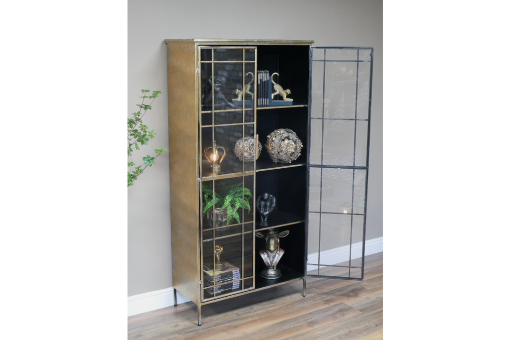 Muted gold tall glass fronted  metal storage display cabinet.