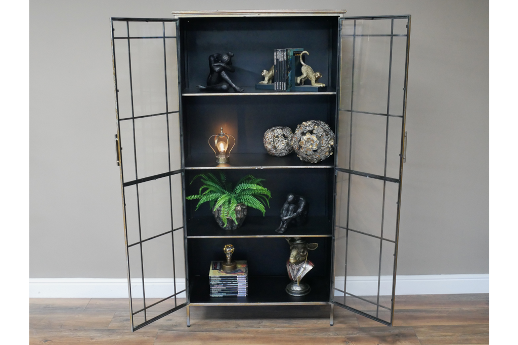 Muted gold tall glass fronted  metal storage display cabinet.
