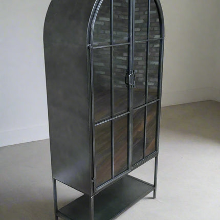 Arched tall slim glass fronted black metal storage display cabinet.