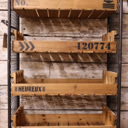 Wooden storage cart with metal frame against a wooden wall UK