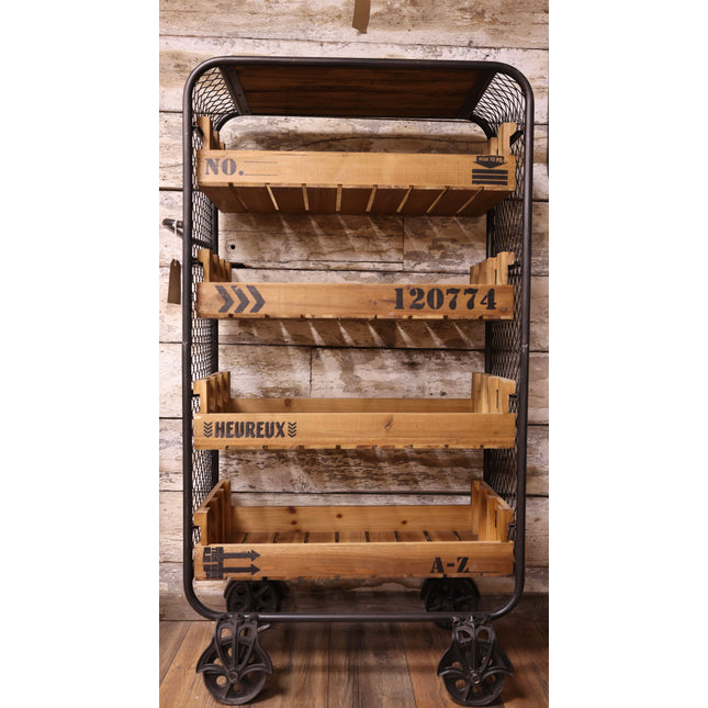 Wooden storage cart with metal frame against a wooden wall UK