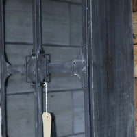 Black metal wall storage cabinet with double glass doors