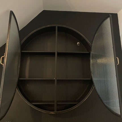 Big round black metal wall cabinet with ribbed glass double doors
