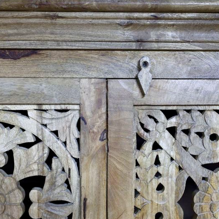 Tall ornate carved natural wood storage cupboard