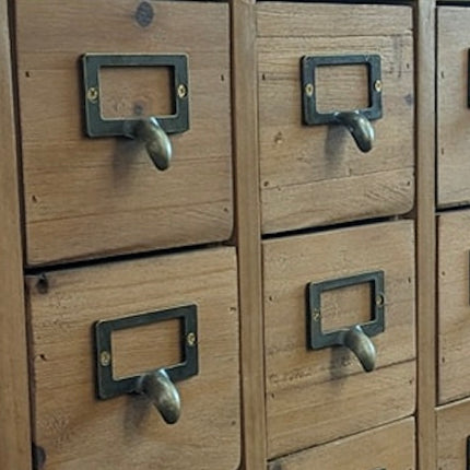 Wood multi drawer apothecary storage cabinet.