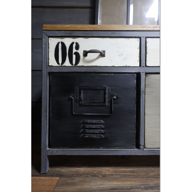 Vintage-style cabinet with number '06' on a wooden floor.
