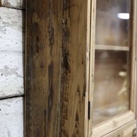 Glass fronted rustic wood wall cabinet