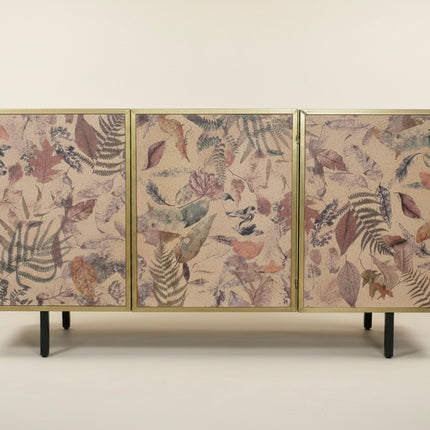 A three-panel sideboard or credenza with a gold-toned frame, featuring botanical leaf patterns in muted pink, brown, gray, and blue on a light beige background, supported by slim black legs against a plain light beige studio backdrop - Elderflower Lane