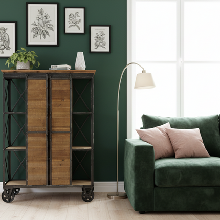 Rustic storage cabinet with sliding barn doors in modern living room with green velvet sofa and botanical wall art UK - Elderflower Lane
