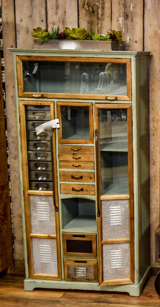 Tall green wood & metal multi drawer industrial storage cabinet.