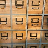 Green multi compartment wood storage cabinet