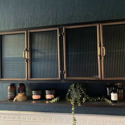 Black & muted gold wide Industrial retro metal & ribbed glass wall cabinet.